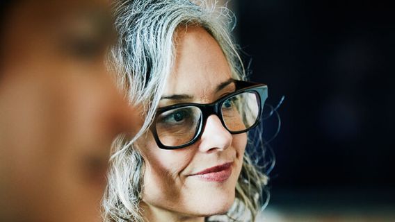 Woman smiling and listening