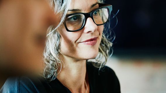 Woman smiling and listening